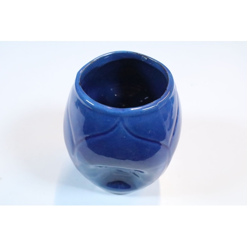 35 - Group of five Brannam Barum Barnstaple pottery pieces to include puzzle jugs, jug, vase and a grotes... 