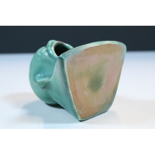 35 - Group of five Brannam Barum Barnstaple pottery pieces to include puzzle jugs, jug, vase and a grotes... 