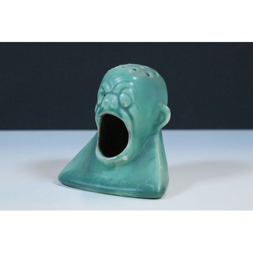 35 - Group of five Brannam Barum Barnstaple pottery pieces to include puzzle jugs, jug, vase and a grotes... 