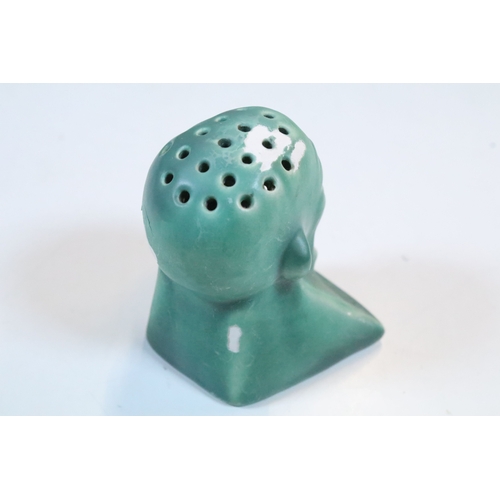 35 - Group of five Brannam Barum Barnstaple pottery pieces to include puzzle jugs, jug, vase and a grotes... 