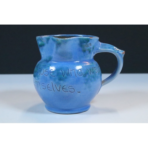 35 - Group of five Brannam Barum Barnstaple pottery pieces to include puzzle jugs, jug, vase and a grotes... 