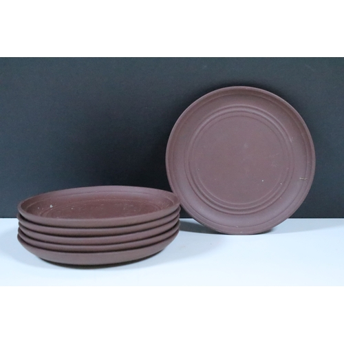 38 - Chinese Yixing terracotta part tea set, the teapot having dragon handle, having four tea cups and si... 