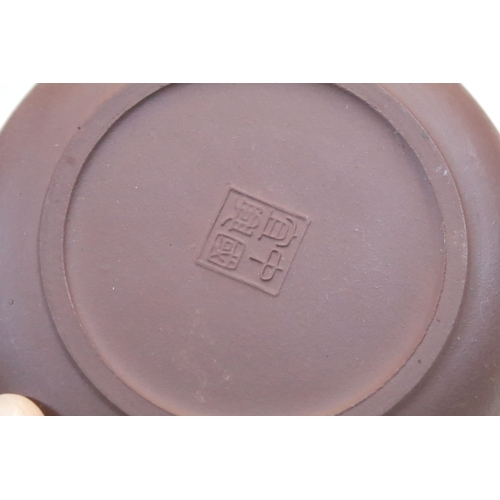 38 - Chinese Yixing terracotta part tea set, the teapot having dragon handle, having four tea cups and si... 