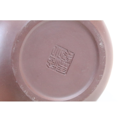 38 - Chinese Yixing terracotta part tea set, the teapot having dragon handle, having four tea cups and si... 