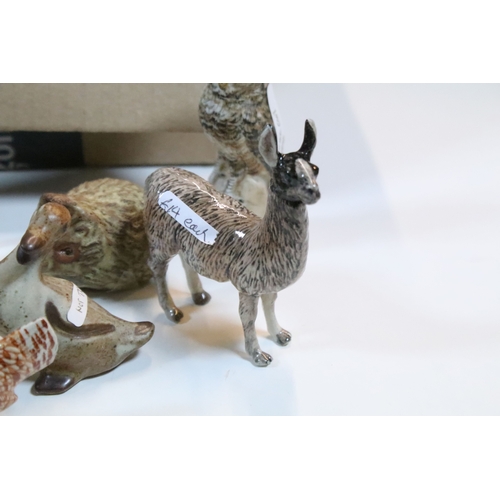 40 - Large selection of Wade and other assorted ceramic figurines to include Bear Ambition and Whimsies e... 