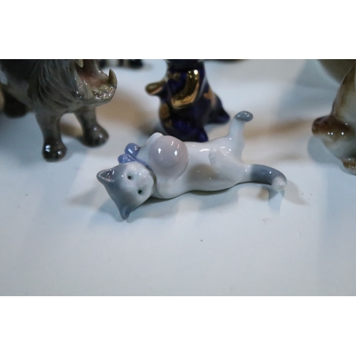 40 - Large selection of Wade and other assorted ceramic figurines to include Bear Ambition and Whimsies e... 