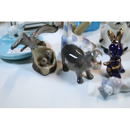 40 - Large selection of Wade and other assorted ceramic figurines to include Bear Ambition and Whimsies e... 