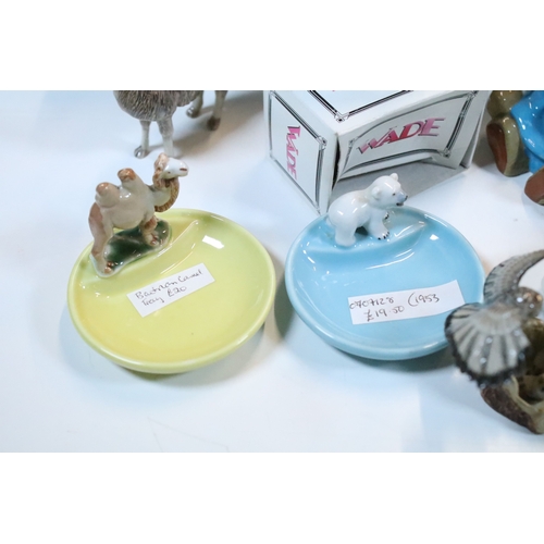 40 - Large selection of Wade and other assorted ceramic figurines to include Bear Ambition and Whimsies e... 