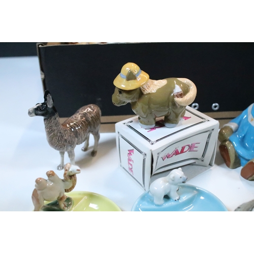 40 - Large selection of Wade and other assorted ceramic figurines to include Bear Ambition and Whimsies e... 