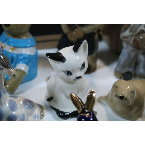 40 - Large selection of Wade and other assorted ceramic figurines to include Bear Ambition and Whimsies e... 