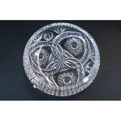 50 - Large crystal glass centre fruit bowl on three scrolled feet together with a four piece crystal glas... 