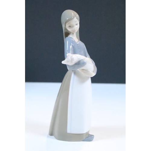 52 - Group of six Lladro porcelain figurines to include 'girl with polar bear', 'girl with pig', 'girl wi... 