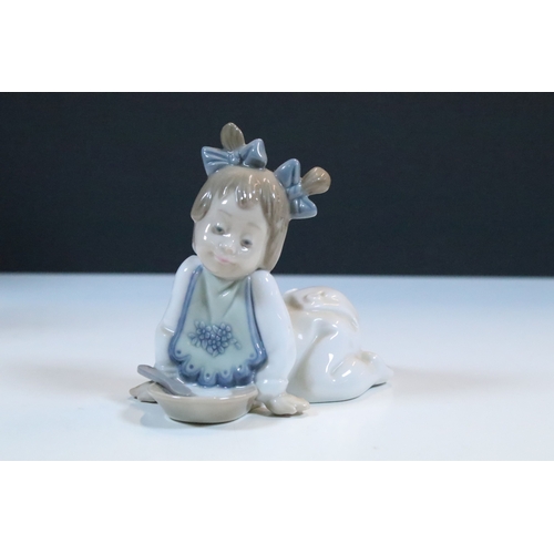 52 - Group of six Lladro porcelain figurines to include 'girl with polar bear', 'girl with pig', 'girl wi... 