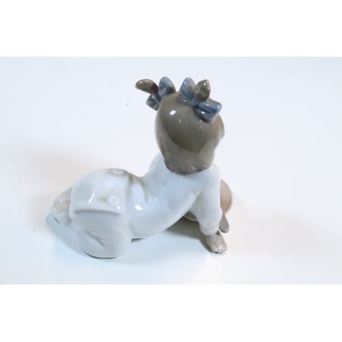 52 - Group of six Lladro porcelain figurines to include 'girl with polar bear', 'girl with pig', 'girl wi... 