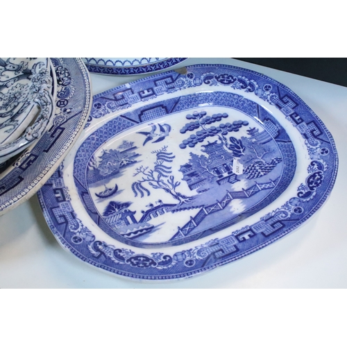 58 - Group of large blue and white pattern serving and meat platters to include willow pattern, Losol war... 