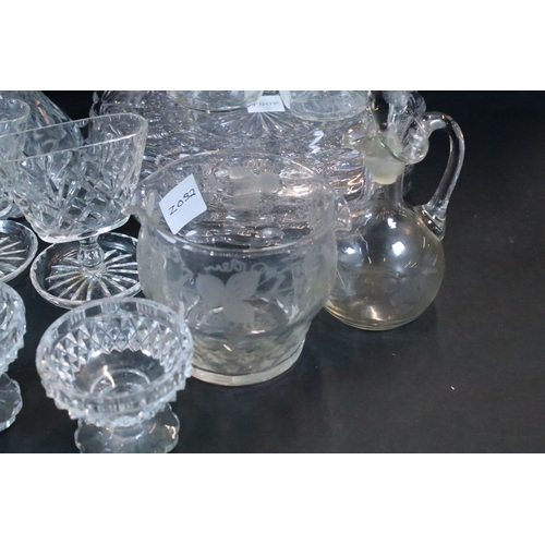 72 - Set of twelve glass plates together with a group of glass ware to include glass ewers, one with silv... 