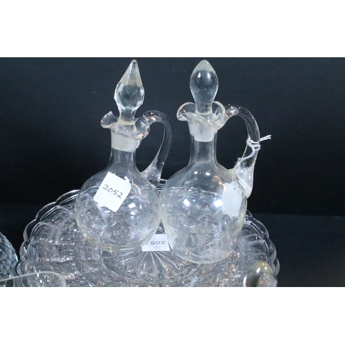 72 - Set of twelve glass plates together with a group of glass ware to include glass ewers, one with silv... 