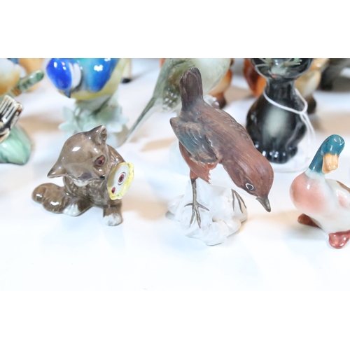 75 - Group of 20th century assorted ceramic animal and bird figurines to include Beswick and Goebel examp... 