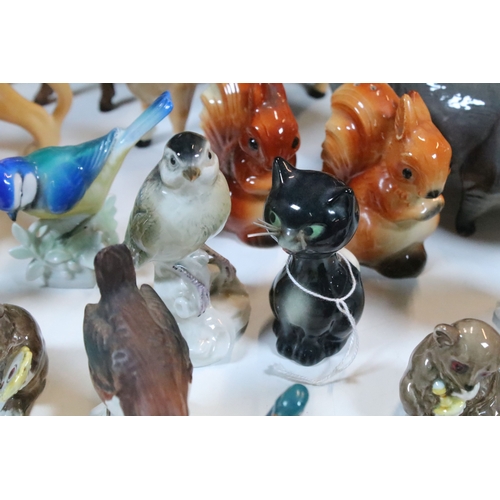 75 - Group of 20th century assorted ceramic animal and bird figurines to include Beswick and Goebel examp... 