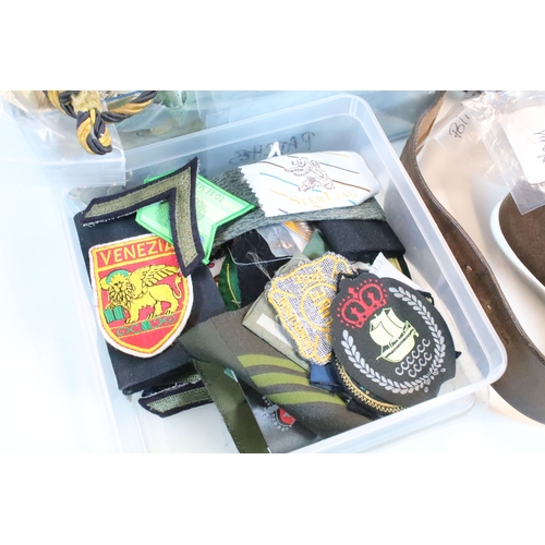 381 - Collection of militaria, to comprise include regimental badges, buttons and belts, etc. (one box)