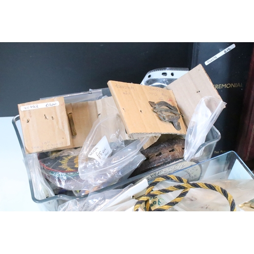 381 - Collection of militaria, to comprise include regimental badges, buttons and belts, etc. (one box)