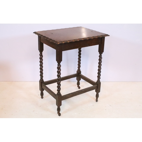 552 - Early 20th century oak side table, having barley twist legs and box stretcher, raised on caps and ca... 