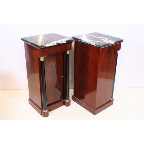 561 - Pair of 20th century mahogany pedestal bedside cabinets, in the Biedermier style, having marble tops... 