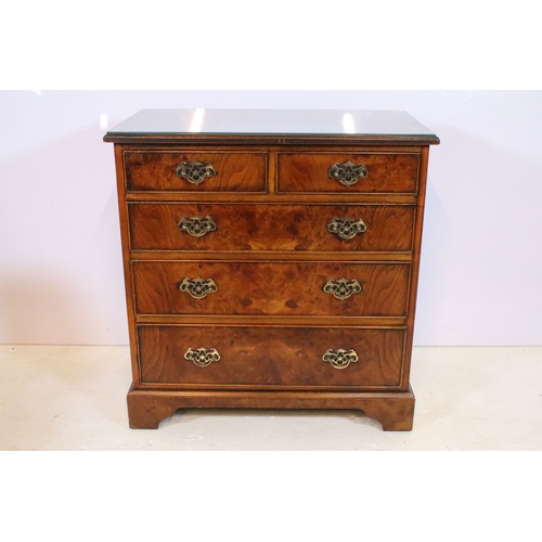 563 - 20th century burr walnut bachelor's chest, in the Georgian style, having two short and three long dr... 
