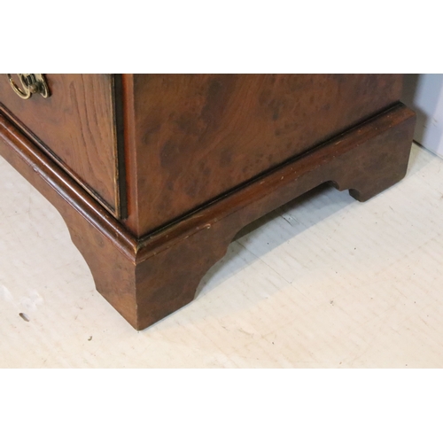563 - 20th century burr walnut bachelor's chest, in the Georgian style, having two short and three long dr... 