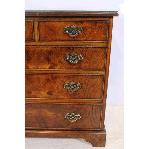 563 - 20th century burr walnut bachelor's chest, in the Georgian style, having two short and three long dr... 