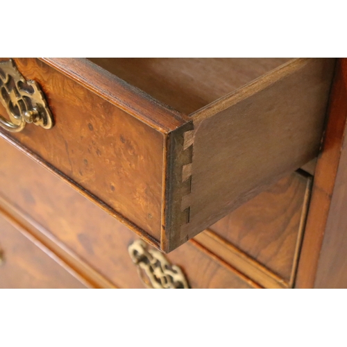 563 - 20th century burr walnut bachelor's chest, in the Georgian style, having two short and three long dr... 