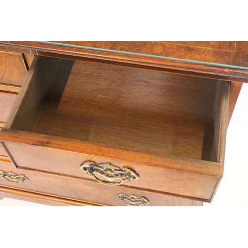 563 - 20th century burr walnut bachelor's chest, in the Georgian style, having two short and three long dr... 