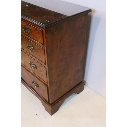 563 - 20th century burr walnut bachelor's chest, in the Georgian style, having two short and three long dr... 
