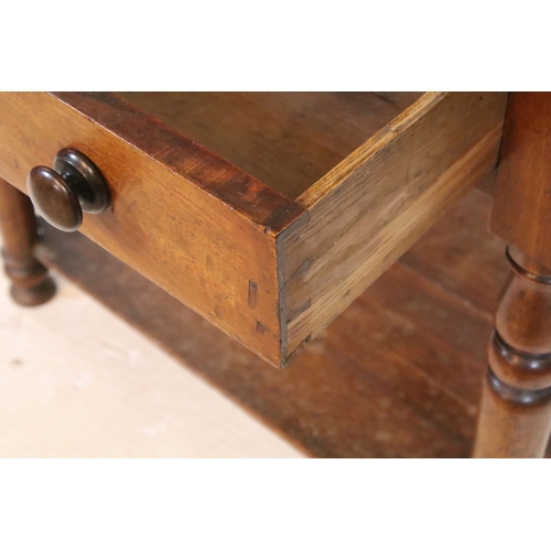 567 - 19th century mahogany two tier occasional table with single drawer on turned legs, 66cm high x 67.5c... 