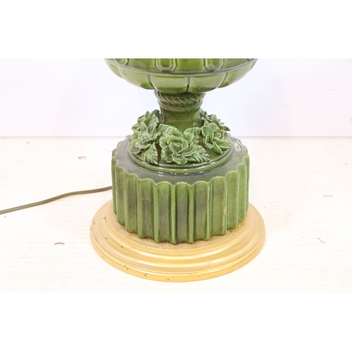 576 - 20th century pottery baluster lamp base, in green glaze with relief work flora, raised on a fluted b... 