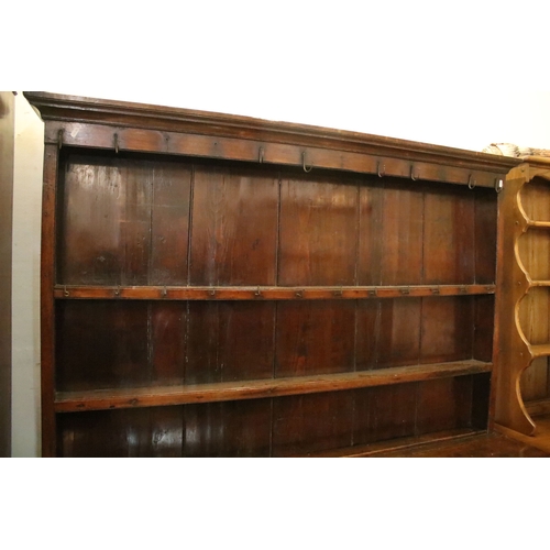Georgian oak dresser, having moulded cornice above shelved plate rack ...