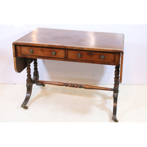 581 - 19th century mahogany sofa table, having cross-banded top with two frieze drawers and two dummy to t... 