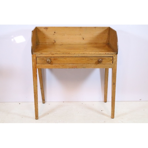 583 - Victorian pine wash-stand, having three-quarter galleried back over two frieze drawers, raised on sq... 