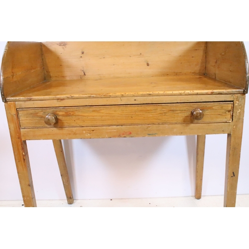 583 - Victorian pine wash-stand, having three-quarter galleried back over two frieze drawers, raised on sq... 