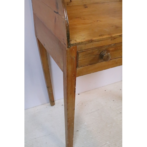 583 - Victorian pine wash-stand, having three-quarter galleried back over two frieze drawers, raised on sq... 