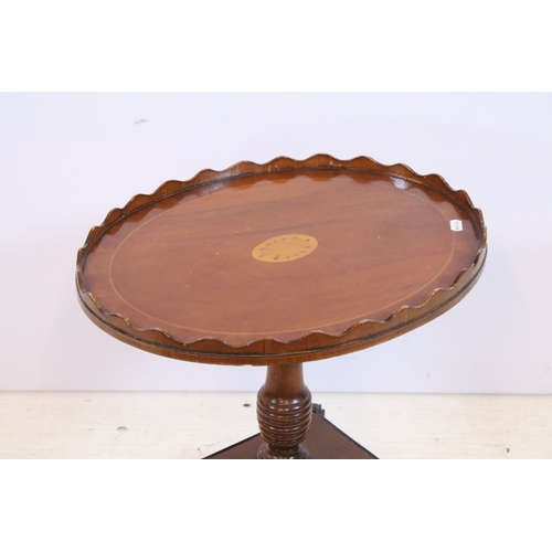 584 - 19th century mahogany side table, having square top on open shelf and shaped X-stretcher, raised on ... 