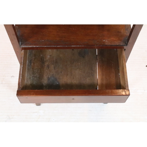 584 - 19th century mahogany side table, having square top on open shelf and shaped X-stretcher, raised on ... 