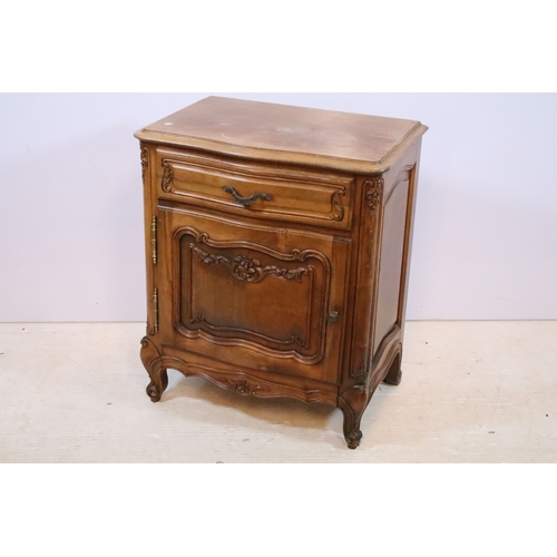 601 - 20th century French-style walnut bedside cabinet, having heavily moulded decoration to door and feet... 