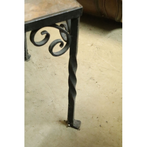 609 - Wrought metal and onyx topped coffee table, having stone inset to the top, raised on twisted legs wi... 