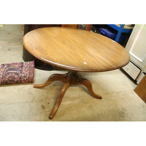 616 - Ercol pedestal extending dining table, having oval top with baluster stem base and swept legs, 110cm... 