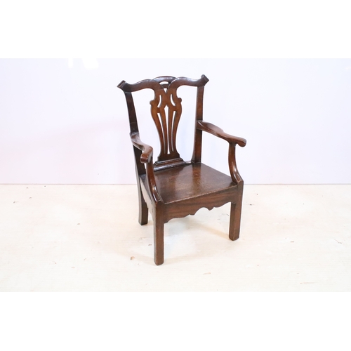 336 - Mahogany child's elbow chair with pierced back splat,  H 61cm, W 37cm, D 28cm