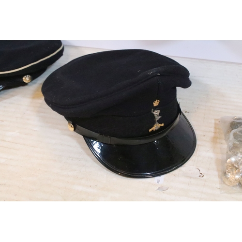 339 - Naval officers uniform jacket together with two caps and an assortment of military buttons