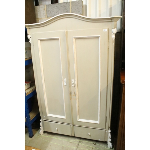 613 - Antique over-painted wardrobe, in the French style, having raised central pediment, above two doors ... 