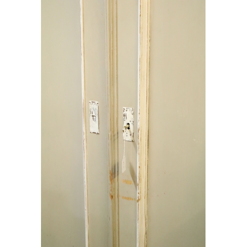 613 - Antique over-painted wardrobe, in the French style, having raised central pediment, above two doors ... 