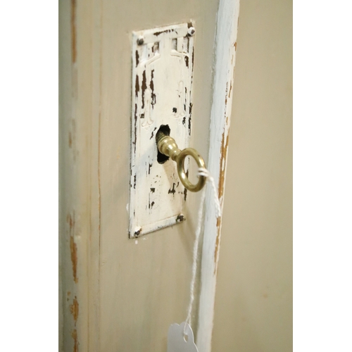 613 - Antique over-painted wardrobe, in the French style, having raised central pediment, above two doors ... 